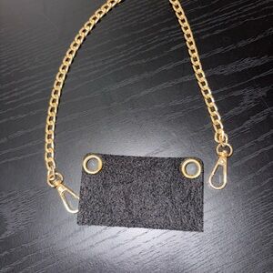 Turn your wallet into a crossbody. Gold and Black Chain Strap Accessory